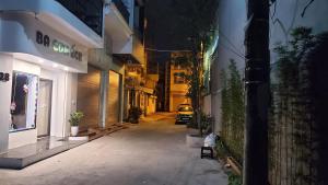 a car driving down a street at night at BA CON ECH Home and Stay- No 28 lane 259 Nguyen Duc Canh in Hai Phong