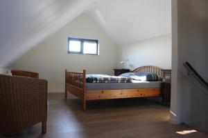 Ένα ή περισσότερα κρεβάτια σε δωμάτιο στο Logement de Garage