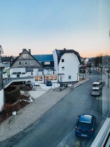 a car parked on a street in a town at Berggeflüster Winterberg- im Herzen Winterbergs in Winterberg +23 photos