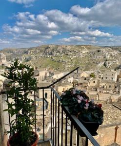 a balcony with a view of a city at Slow Living B&B in Matera