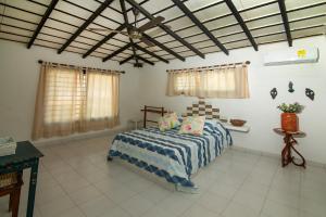 Кровать или кровати в номере Cabana Canaima