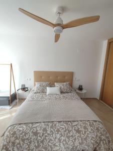 Postel nebo postele na pokoji v ubytování GUADALEST DREAMS