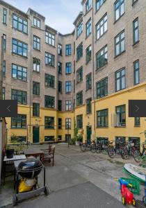 a building with bikes parked in front of it at Central & Cosy Studio + Free Bikes & Netflix in Copenhagen