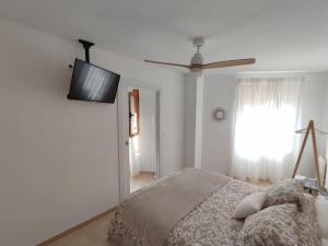 Postel nebo postele na pokoji v ubytování GUADALEST DREAMS