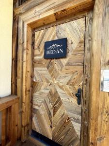 a wooden door with a sign on top of it at Panorama Penthouse mit Sauna & großem Balkon in Gallzein
