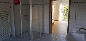 a bathroom with a shower and a sink at Monteurswohnung Tim in Zweibrücken