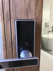 a computer mouse sitting inside of a wooden door at Apartment style Space in Minworth