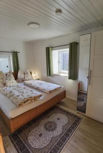 a bedroom with two beds and a window at Ferienhaus Kranach 76 in Gamlitz