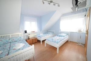 Postel nebo postele na pokoji v ubytování Dom Gościnny Piotr