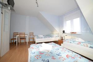 Postel nebo postele na pokoji v ubytování Dom Gościnny Piotr