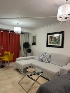 a living room with a couch and a table at DREAM BULEVAR in Santa Cruz de Tenerife