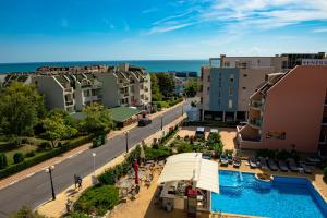 a view of a city with a pool and buildings at Menada Belle View Apartments in Sveti Vlas