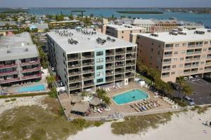 an aerial view of a resort with a swimming pool at 103 - Sandy Shores in St. Pete Beach