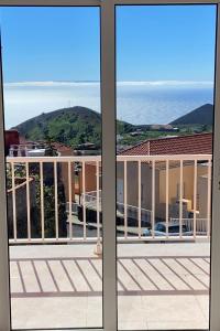 a view of the ocean from the balcony of a house at Casa Ninive in Fuencaliente de la Palma