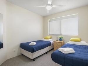 Postel nebo postele na pokoji v ubytování Cheltenham Apartments Unit 11 40 King St + 10 fotografií