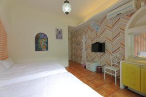 Postel nebo postele na pokoji v ubytování Rainbow B&B