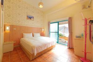 Postel nebo postele na pokoji v ubytování Rainbow B&B
