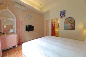Postel nebo postele na pokoji v ubytování Rainbow B&B