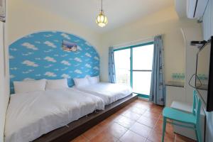 Postel nebo postele na pokoji v ubytování Rainbow B&B