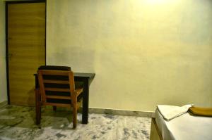 Postel nebo postele na pokoji v ubytování Hotel Arunachala