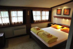 Voodi või voodid majutusasutuse B&B Galerija Two Rooms toas