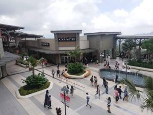 a group of people walking in front of a shopping mall at Genting Geo 38 Premium Home Plus 6 Nr GPO & Skyway in Genting Highlands