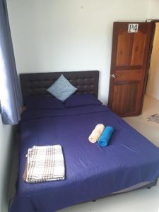 Letto o letti in una camera di P & T Hostel