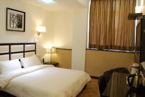 Postel nebo postele na pokoji v ubytování Hotel Oyster