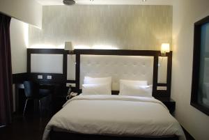 Postel nebo postele na pokoji v ubytování Hotel Oyster