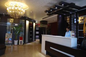 Členové personálu v ubytování Hotel Oyster