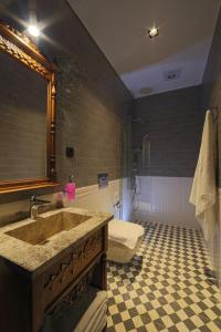 a bathroom with a sink and a shower at Sam Franss Boutique Otel in Hatay