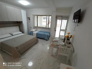 Postel nebo postele na pokoji v ubytování Mamalina Residence