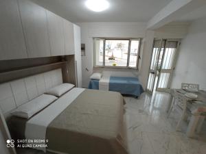 Postel nebo postele na pokoji v ubytování Mamalina Residence