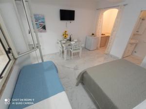 Postel nebo postele na pokoji v ubytování Mamalina Residence