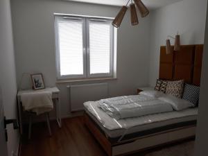 Posteľ alebo postele v izbe v ubytovaní Apartament Projektant