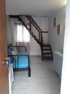 a room with a bunk bed and a staircase at La Casetta Rosa in Monterosso al Mare