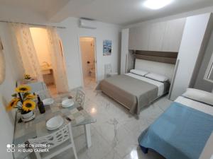 Postel nebo postele na pokoji v ubytování Mamalina Residence