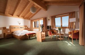 Postel nebo postele na pokoji v ubytování Hotel Aletsch