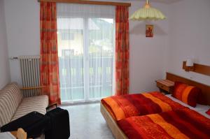 Postel nebo postele na pokoji v ubytování Haus Dachstein Schnitzer