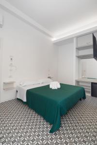 Voodi või voodid majutusasutuse Seven Rooms toas