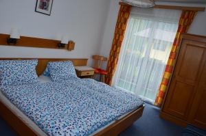 Postel nebo postele na pokoji v ubytování Haus Dachstein Schnitzer