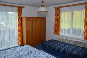 Postel nebo postele na pokoji v ubytování Haus Dachstein Schnitzer