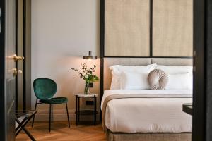 Ein Bett oder Betten in einem Zimmer der Unterkunft Palazzo Rainis Hotel & Spa - Small Luxury Hotel - Adults Only