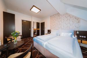 Posteľ alebo postele v izbe v ubytovaní Hotel Hubertus