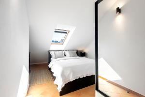 Postel nebo postele na pokoji v ubytování Apartman Luri