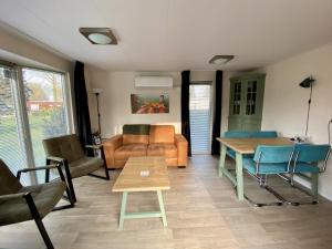 Posezení v ubytování Chalet de Huismus