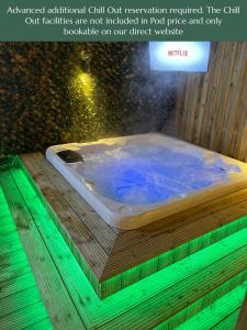 a bath tub sitting on top of a wooden table at Orchard Hideaways in Penrith