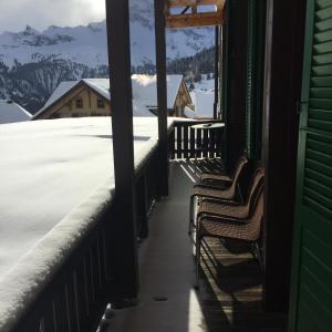 a row of benches in front of a ski lift at Hotel Jungfrau Mürren in Mürren
