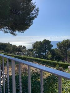 a view of the ocean from a balcony at STUDIO VUE MER /PARKING PRIVATIF in Saint-Raphaël