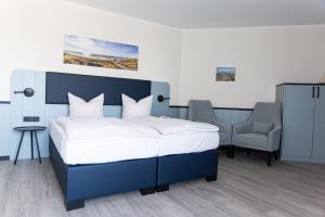 Ein Bett oder Betten in einem Zimmer der Unterkunft TIDE Hotel